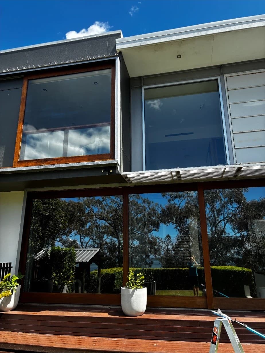 Two storeys of freshly cleaned glass on a Brisbane home, a real Squeegee Bros job